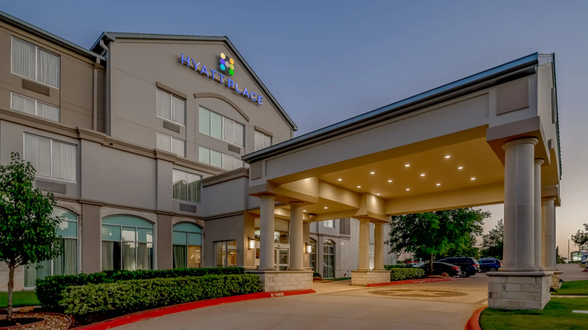 Exterior of Hyatt Place College Station at dusk