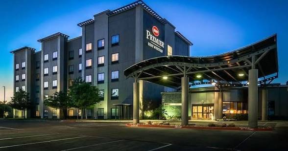 Exterior of Best Western Premier Bryan College Station at dusk